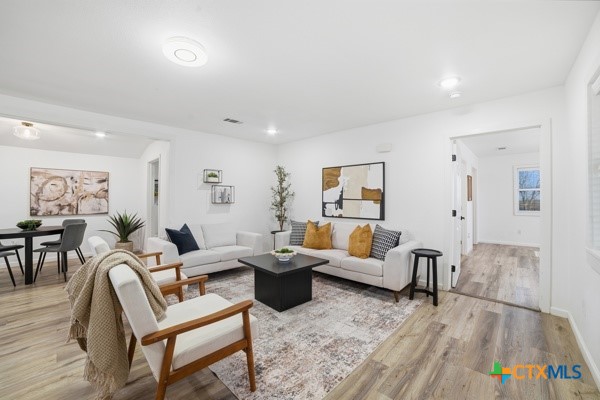 3267 Dairy Road Temple, TX 76501 - Photo 13 of 42 a living room with furniture and wooden floor