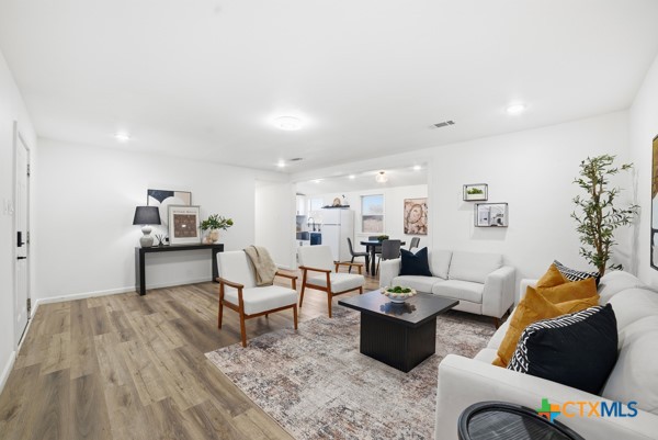 3267 Dairy Road Temple, TX 76501 - Photo 14 of 42 a living room with furniture and wooden floor