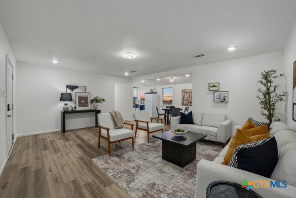 3267 Dairy Road Temple, TX 76501 - Photo 15 of 42 a living room with furniture and wooden floor