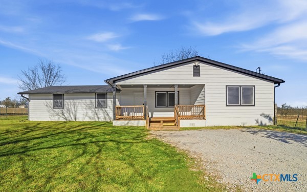 3267 Dairy Road Temple, TX 76501 - Photo 2 of 42 a front view of a house with a yard