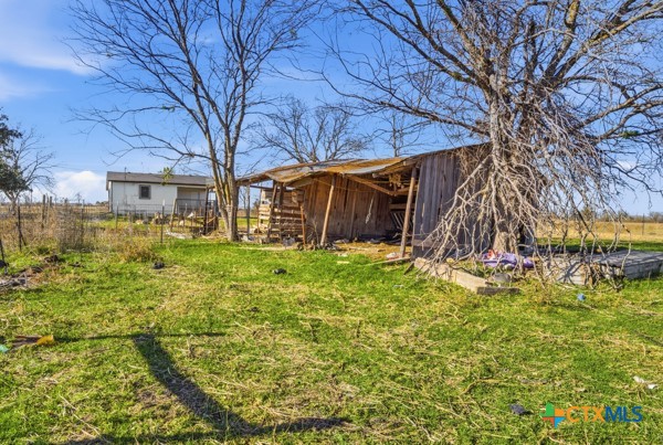 3267 Dairy Road Temple, TX 76501 - Photo 37 of 42 a view of a house with a large tree and a yard