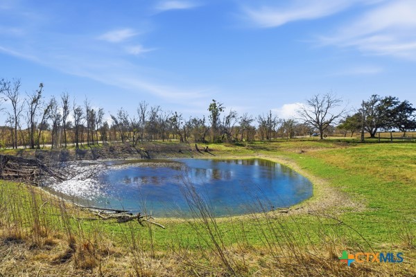 3267 Dairy Road Temple, TX 76501 - Photo 38 of 42 a view of a swimming pool with an outdoor seating and a garden