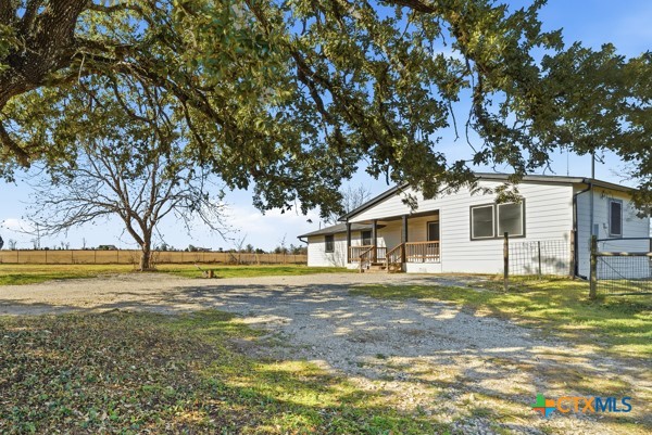 3267 Dairy Road Temple, TX 76501 - Photo 6 of 42 a front view of a house with a garden
