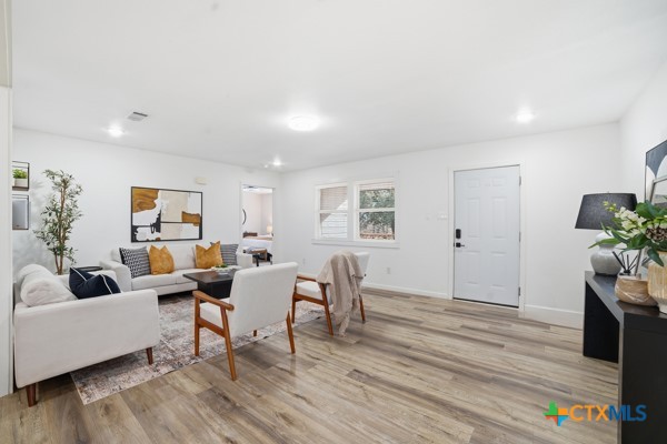 3267 Dairy Road Temple, TX 76501 - Photo 9 of 42 a living room with furniture and wooden floor