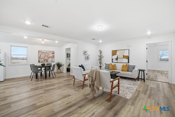 3267 Dairy Road Temple, TX 76501 - Photo 10 of 42 a living room with furniture and wooden floor