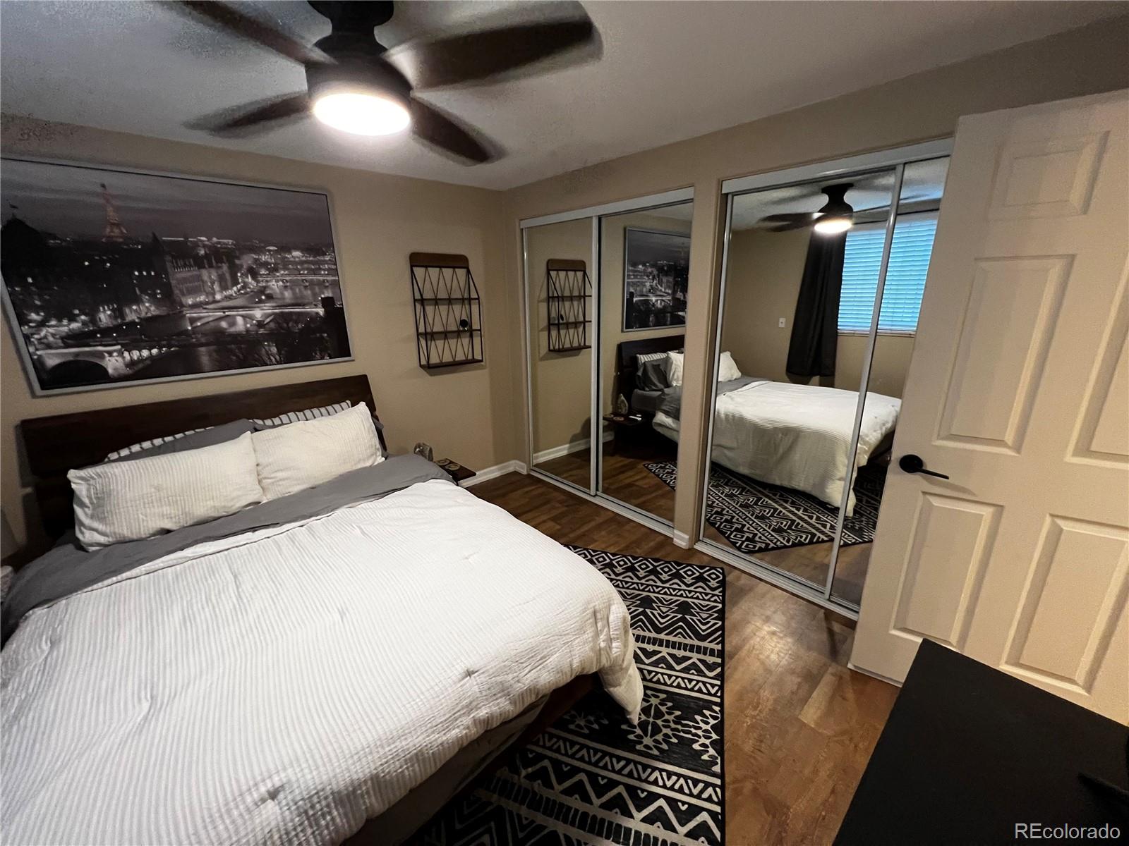 1260 North Humboldt Street, Unit 3 Denver, CO 80218 - Photo 2 of 6 a bedroom with a bed and a mirror