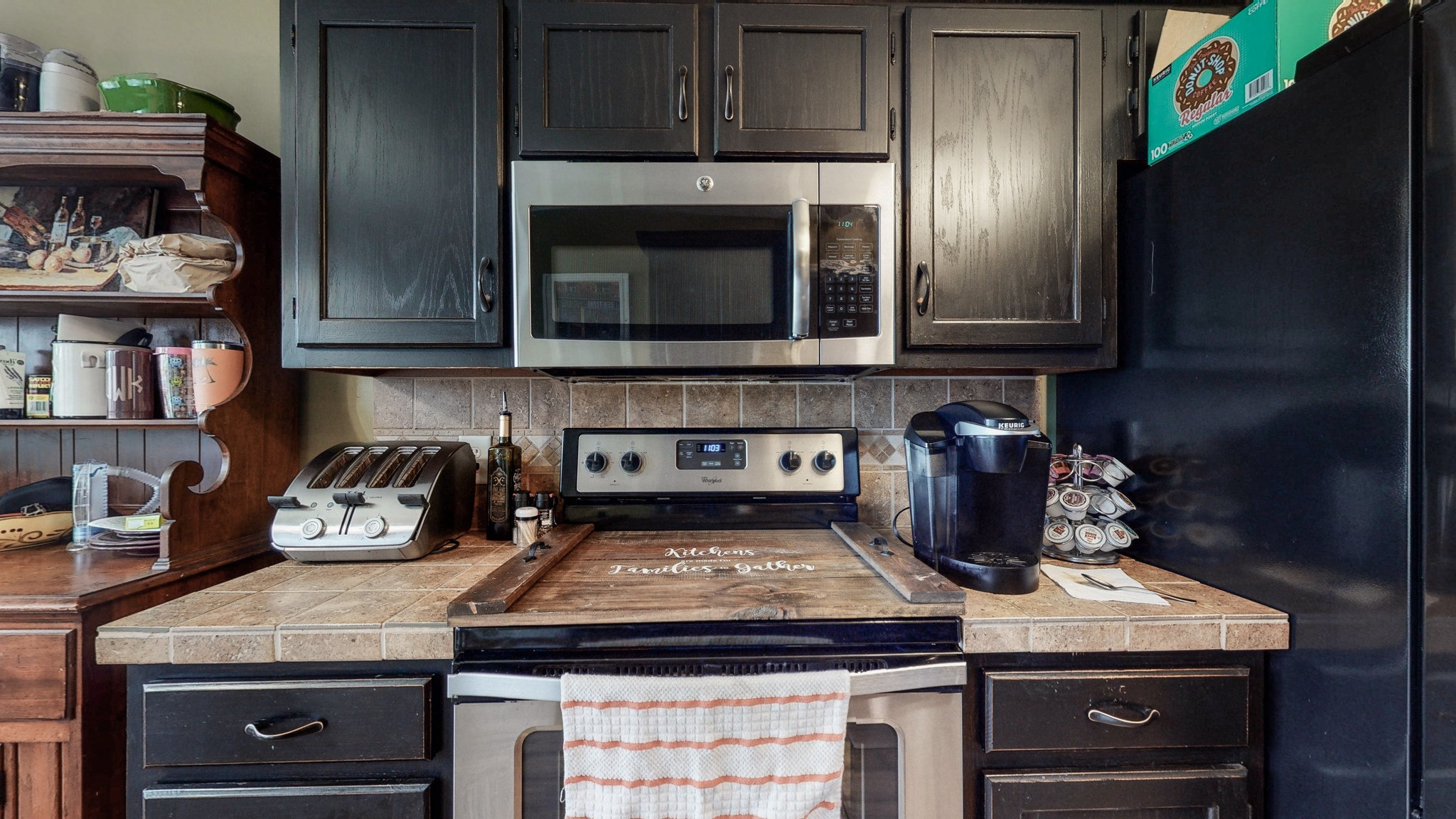 1503 Whitmore Street Lebanon, TN 37087 - Photo 12 of 32 a kitchen with a stove and a microwave