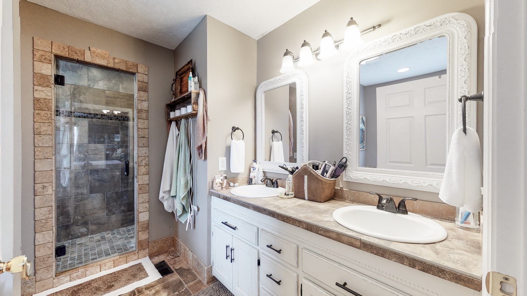 1503 Whitmore Street Lebanon, TN 37087 - Photo 16 of 32 a bathroom with a double vanity sink mirror and shower
