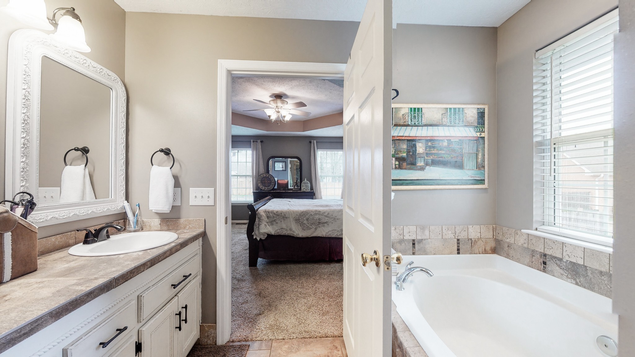 1503 Whitmore Street Lebanon, TN 37087 - Photo 18 of 32 a en suite spacious bathroom with a granite countertop tub and a sink