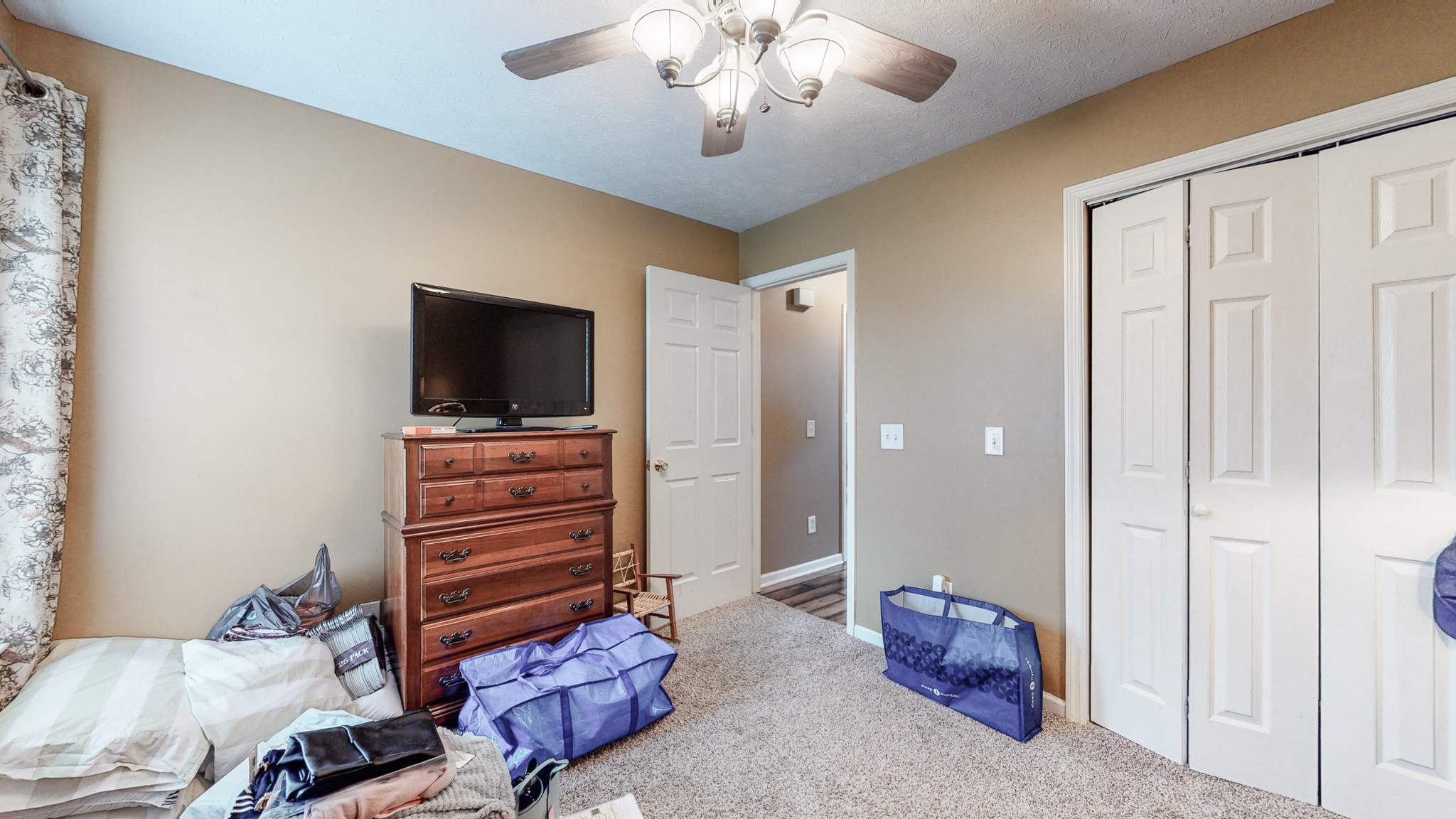 1503 Whitmore Street Lebanon, TN 37087 - Photo 23 of 32 a living room with furniture and a flat screen tv