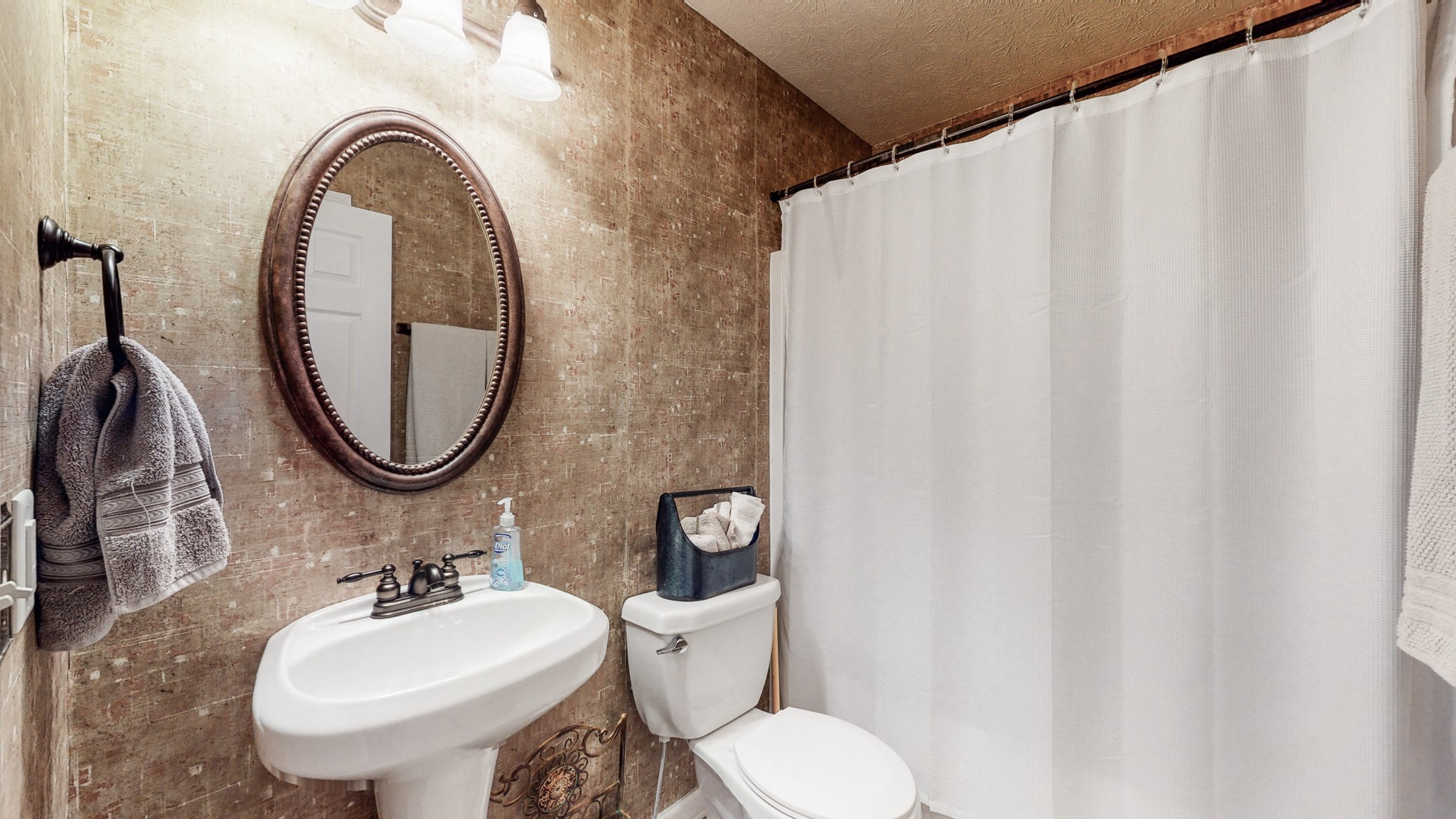 1503 Whitmore Street Lebanon, TN 37087 - Photo 24 of 32 a bathroom with a toilet sink and mirror