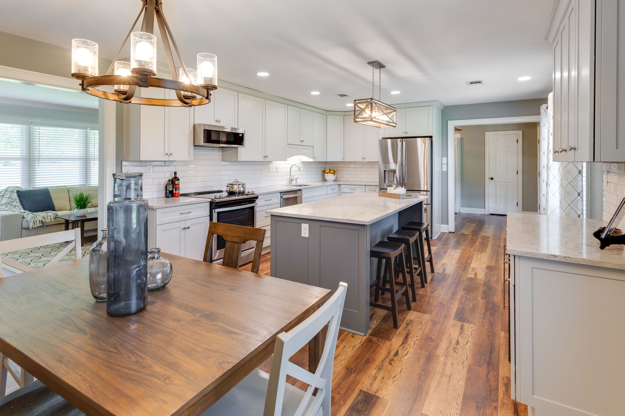 6179 Pettus Road Antioch, TN 37013 - Photo 2 of 57 Plenty of room for entertaining! Coffee bar over on the right with cabinets above. You're looking through to LR and to central foyer with pantry and sunroom. NEW water heater 7-20-23!