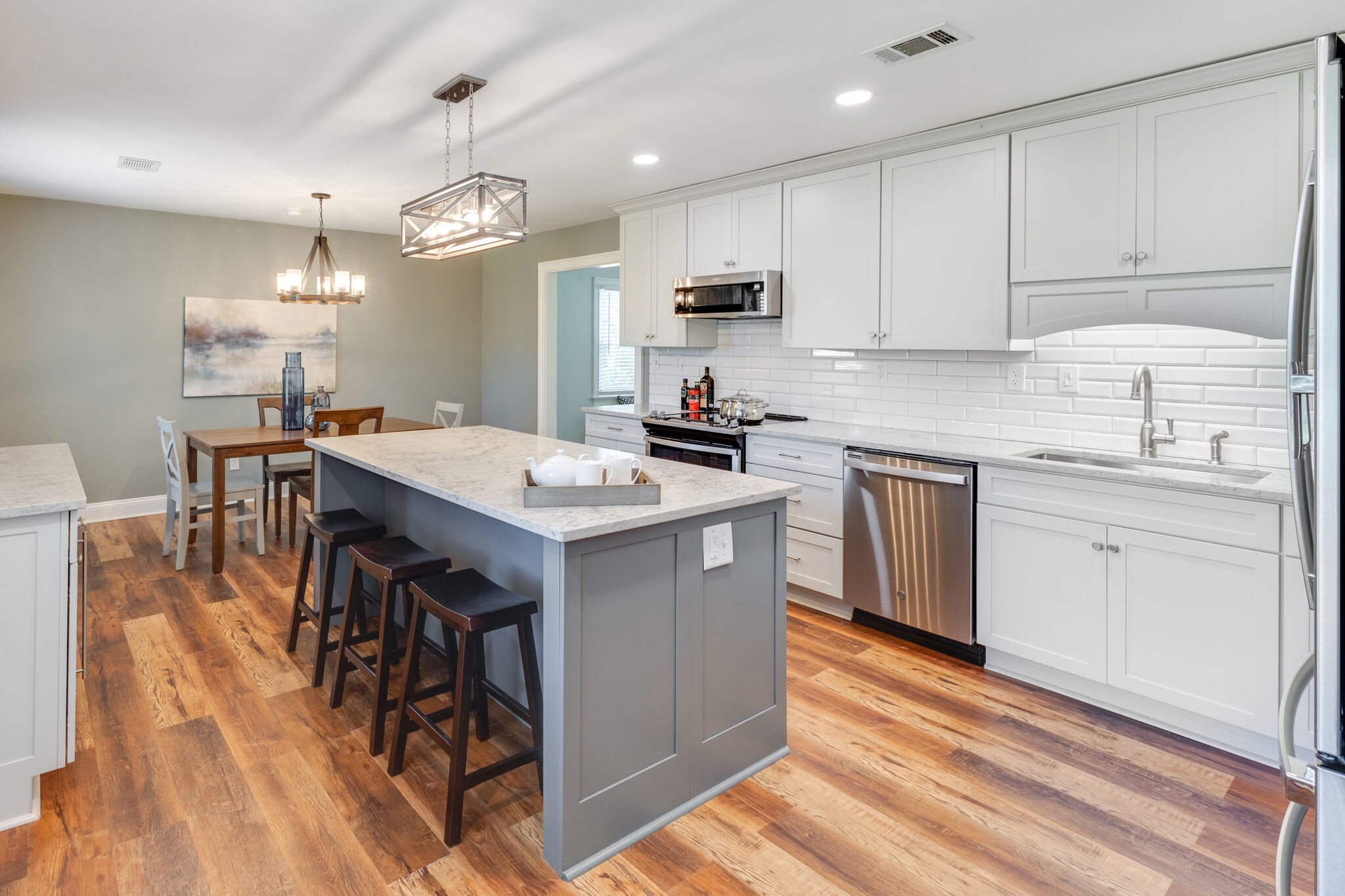 6179 Pettus Road Antioch, TN 37013 - Photo 3 of 57 There's so many nice features in this NEW kitchen! Over 6' island with quartz counters. HUGE soft-close drawers/cabinets! Subway tile splash. New SS appliances including frig remain. Wine chiller in coffee bar!