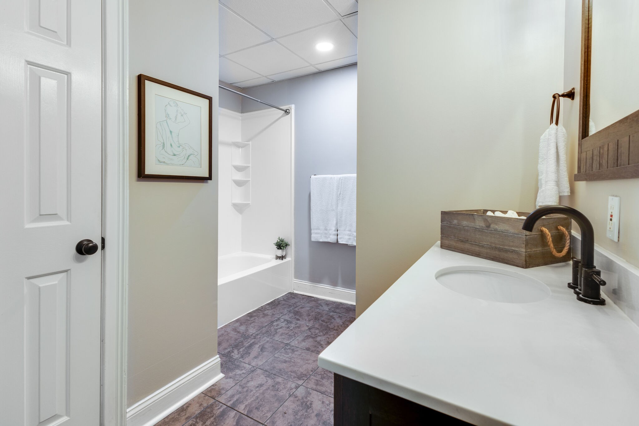 6179 Pettus Road Antioch, TN 37013 - Photo 44 of 57 Bath down with walk-in closet. Tile flooring. Toilet set back behind the wall on the right.