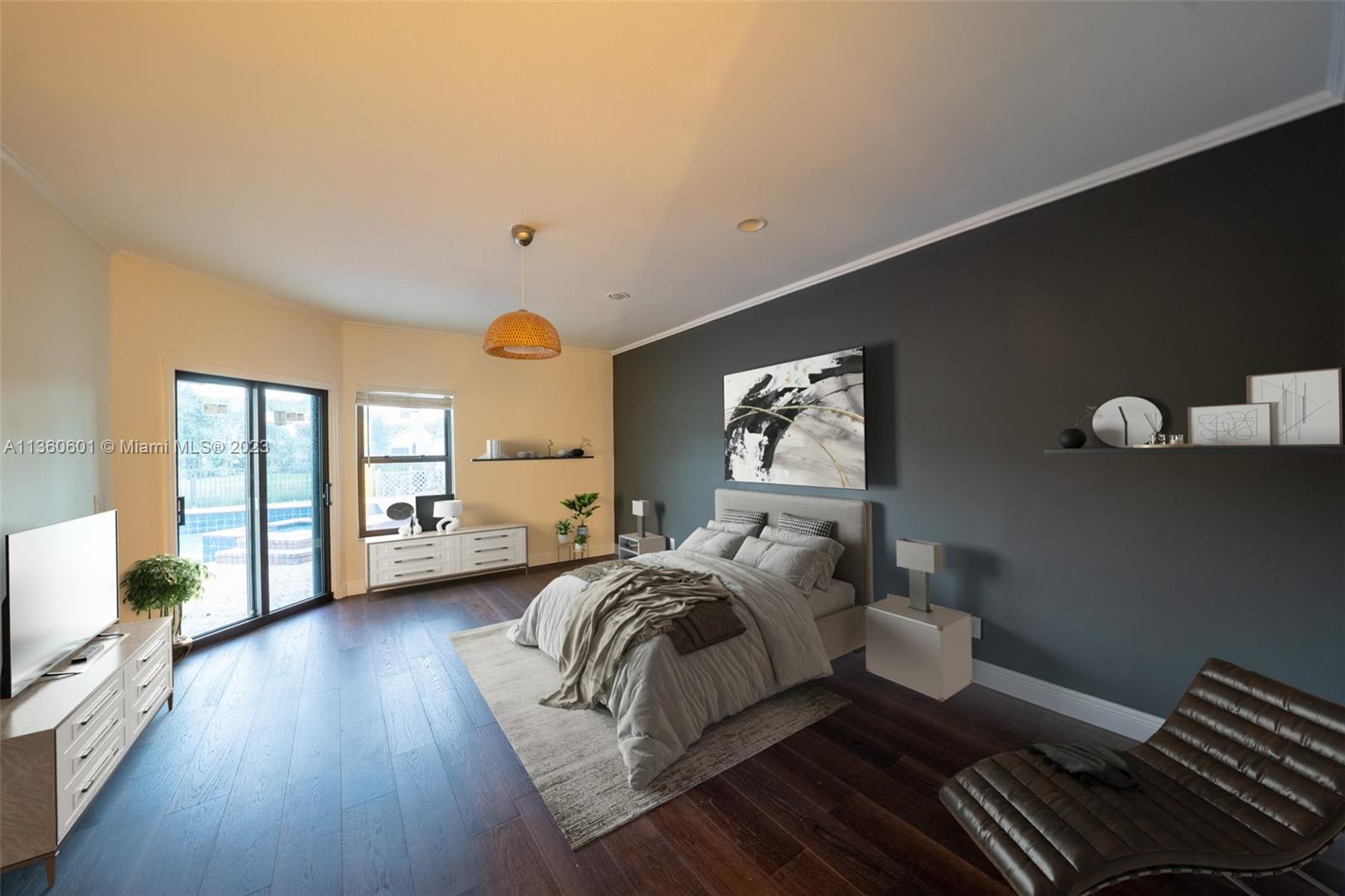 23299 Mirabella Circle North Boca Raton, FL 33433 - Photo 11 of 30 a spacious bedroom with a bed and wooden floor