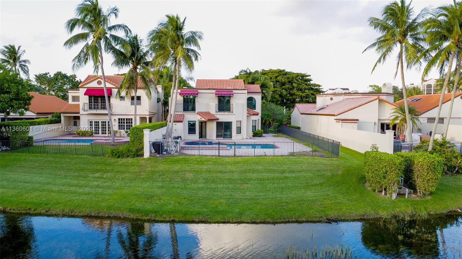 23299 Mirabella Circle North Boca Raton, FL 33433 - Photo 14 of 30 a view of a house with a backyard and a patio