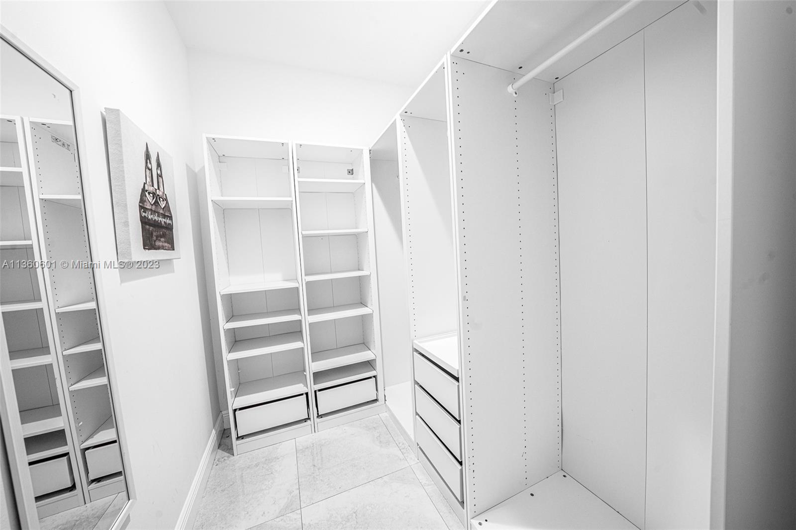 23299 Mirabella Circle North Boca Raton, FL 33433 - Photo 22 of 30 a view of closet area with empty racks