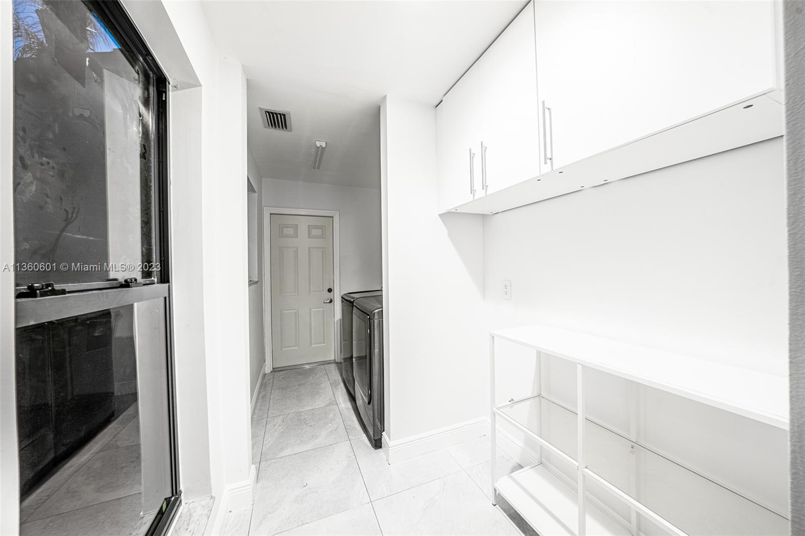 23299 Mirabella Circle North Boca Raton, FL 33433 - Photo 26 of 30 a view of walk in closet with living room
