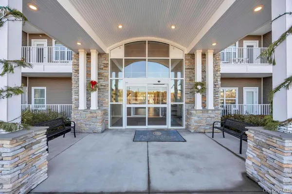 a view of a building with sitting area