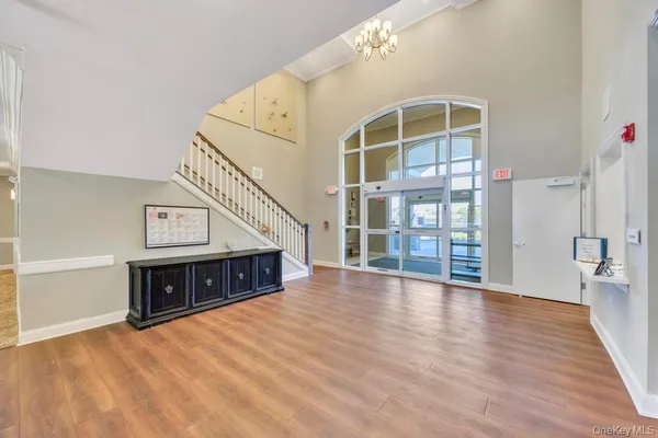 a view of an entryway with wooden floor