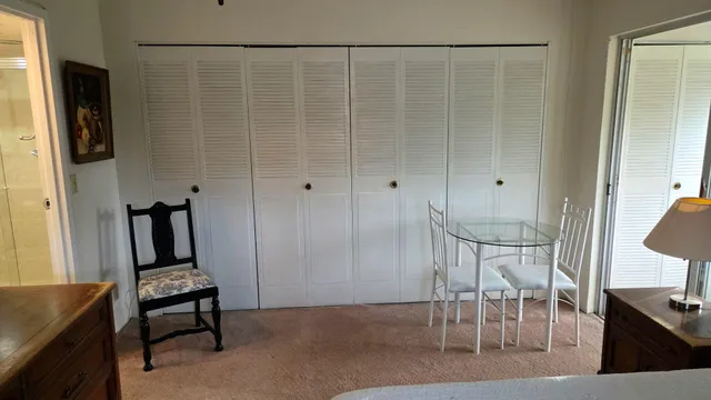 a view of room with furniture and wooden floor