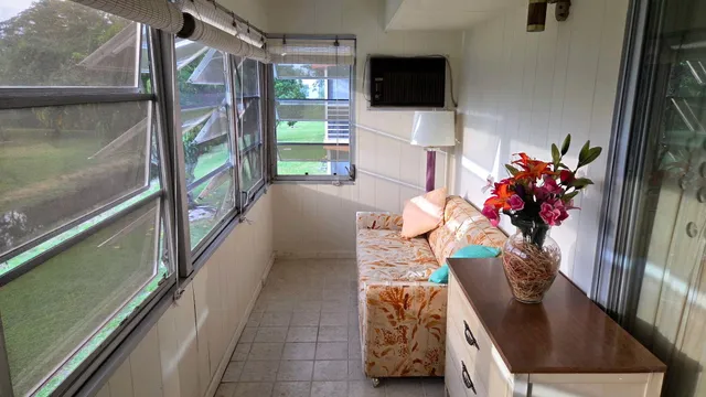 a view of hall way with furniture