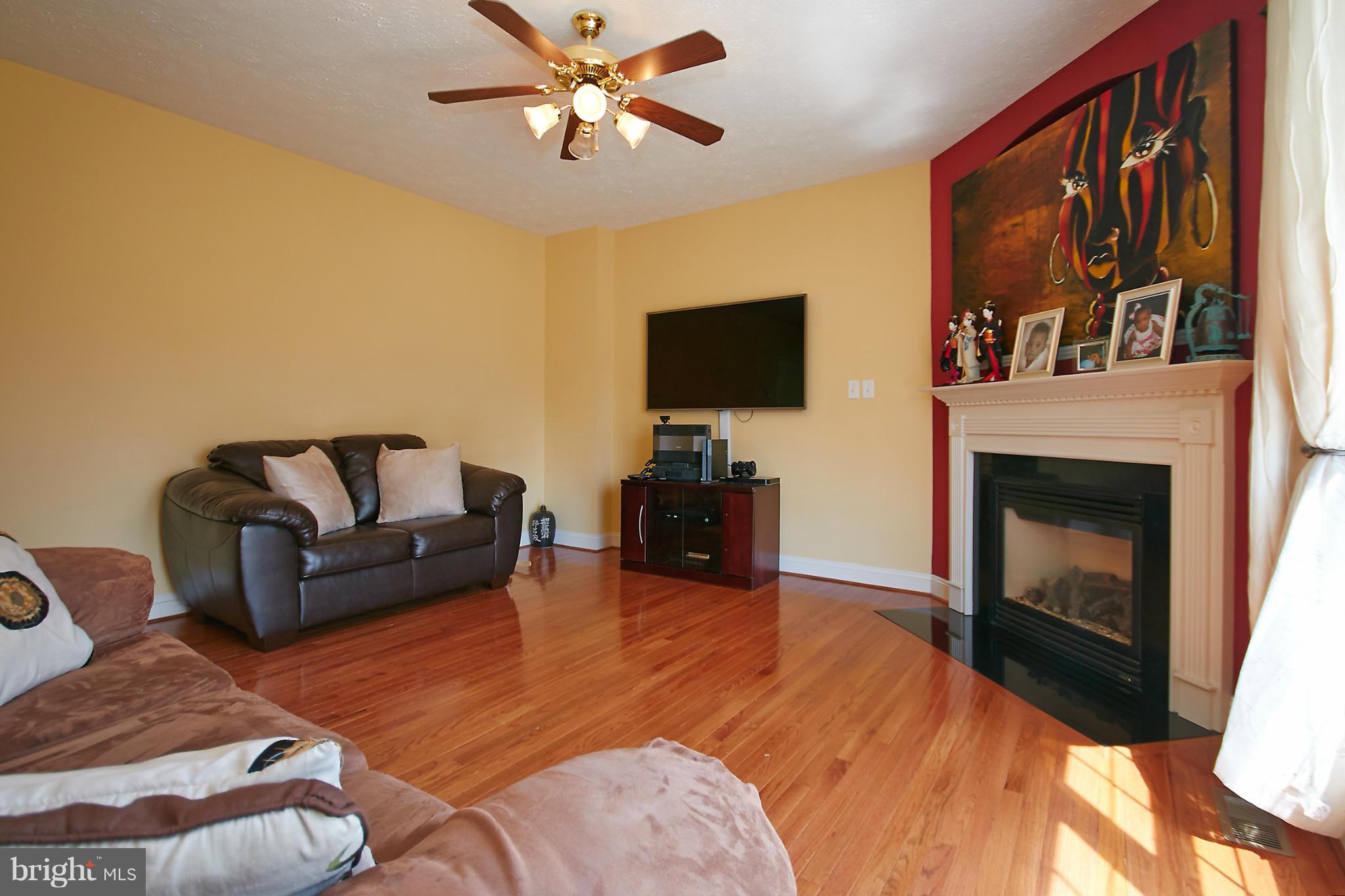 4 Yosemite Ridge Court Stafford, VA 22554 - Photo 13 of 26 a living room with furniture and a fireplace