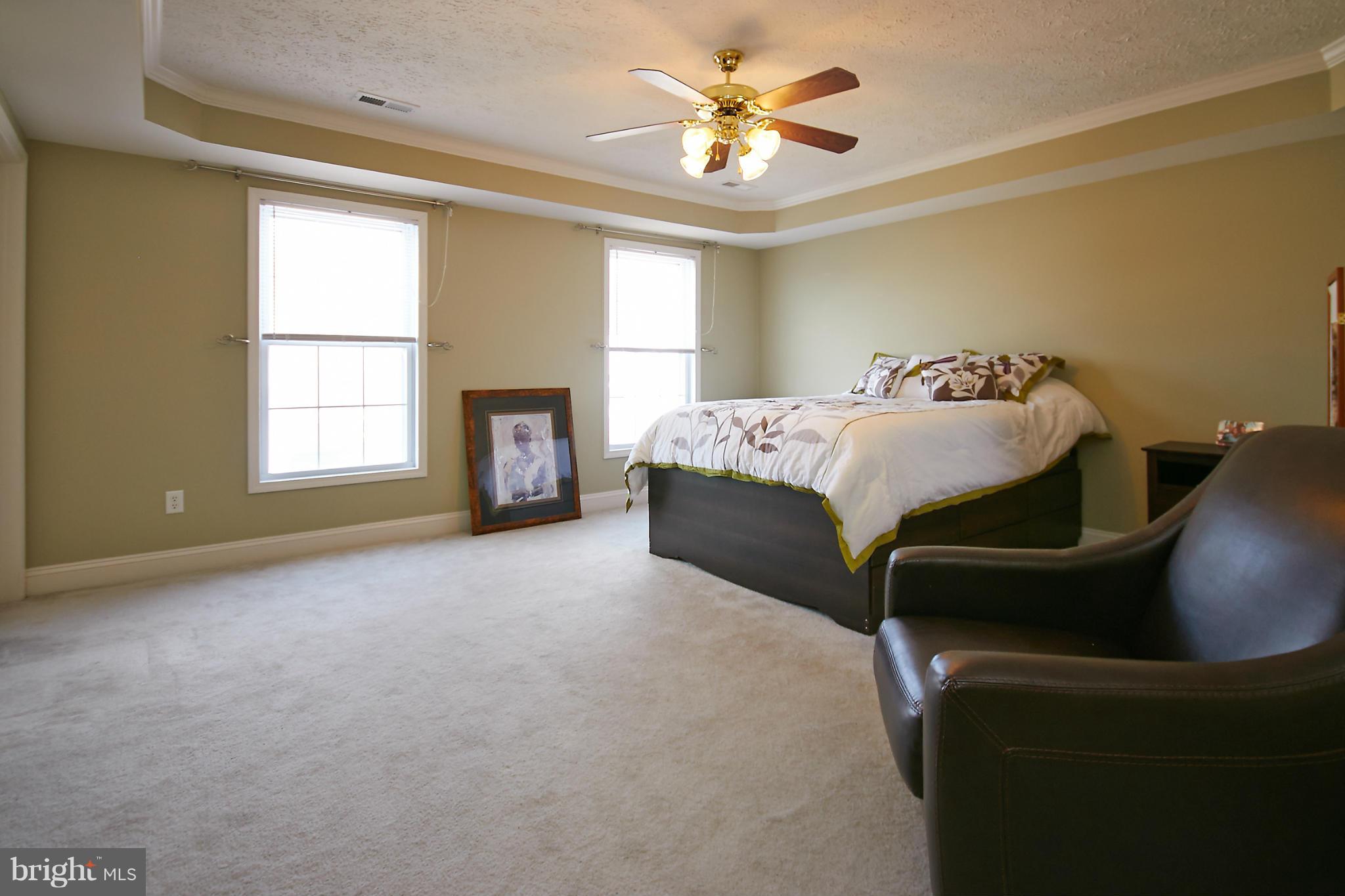 4 Yosemite Ridge Court Stafford, VA 22554 - Photo 14 of 26 a bedroom with a bed and a couch