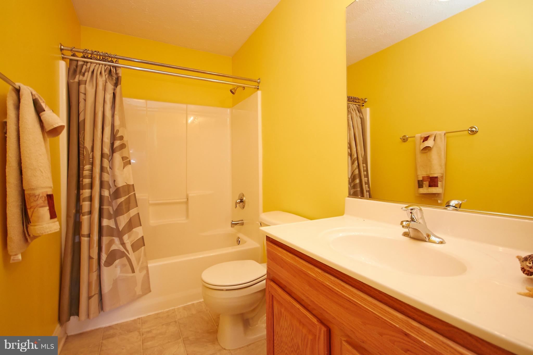 4 Yosemite Ridge Court Stafford, VA 22554 - Photo 22 of 26 a bathroom with a sink a toilet and shower