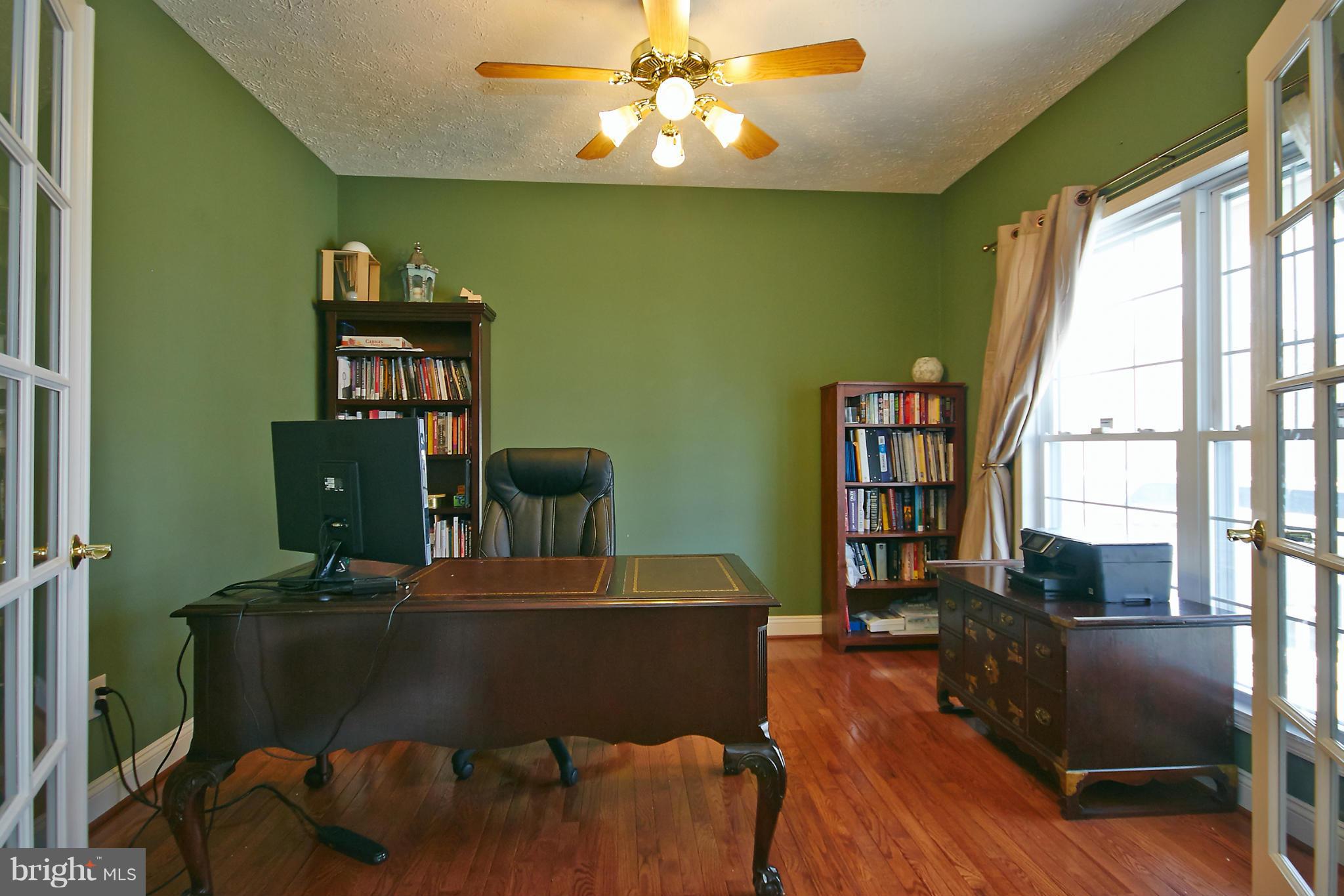 4 Yosemite Ridge Court Stafford, VA 22554 - Photo 5 of 26 a workspace with furniture window and wooden floor