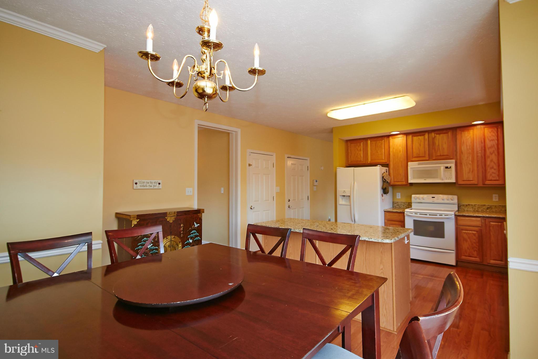 4 Yosemite Ridge Court Stafford, VA 22554 - Photo 9 of 26 a dining room with furniture and wooden floor