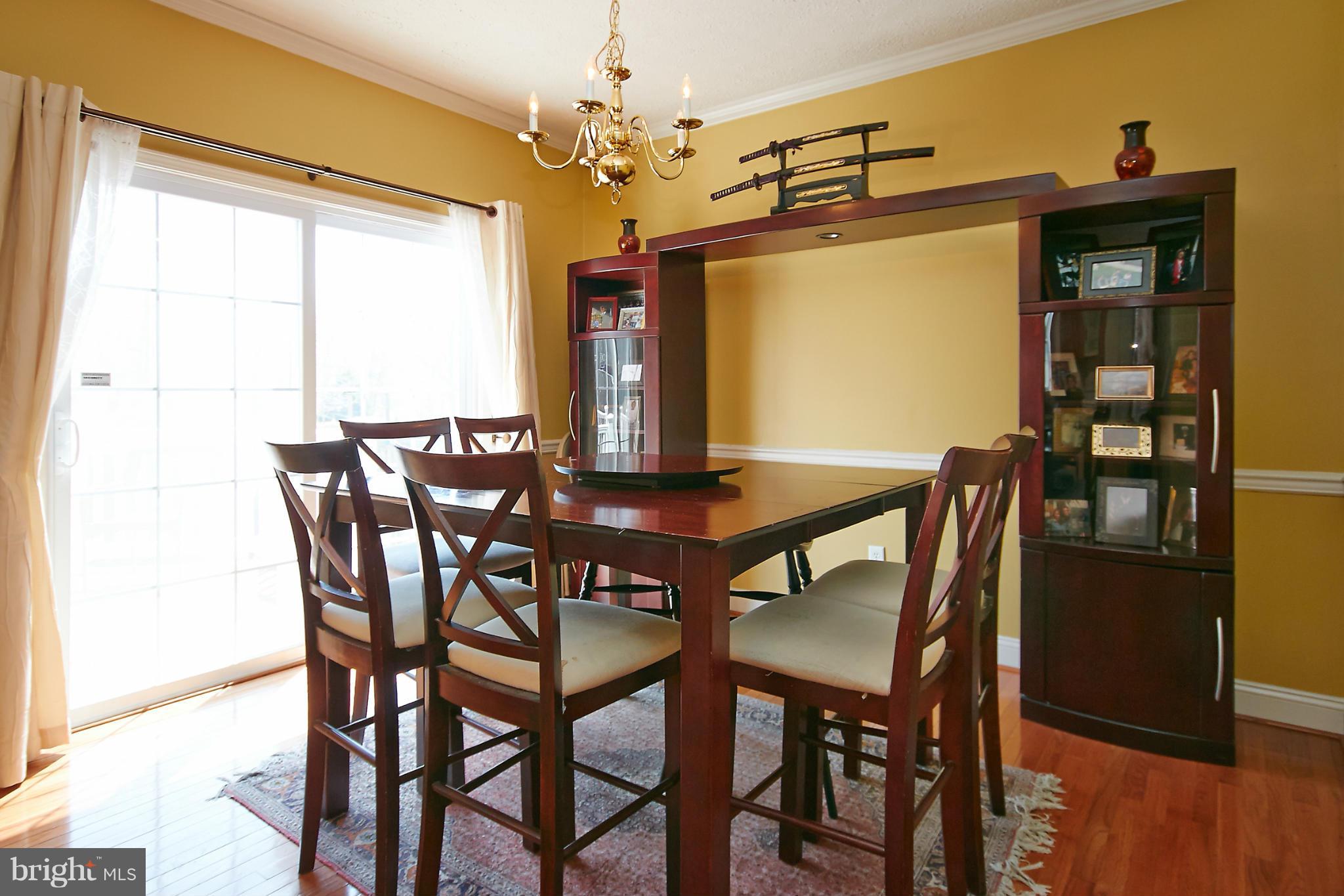 4 Yosemite Ridge Court Stafford, VA 22554 - Photo 10 of 26 a view of a dining room with furniture window and wooden floor