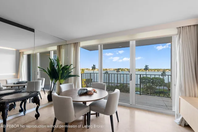 a view of a dining room with furniture and window