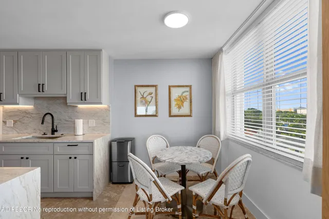 a kitchen with stainless steel appliances a sink a stove a microwave and cabinets