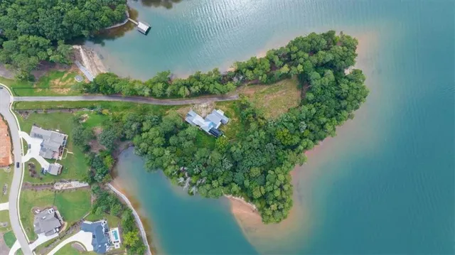 an aerial view of a house with a yard and a garden