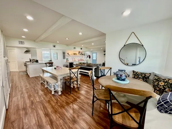 a kitchen with refrigerator and cabinets