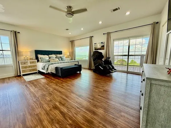 a bathroom with a double vanity sink mirror and toilet