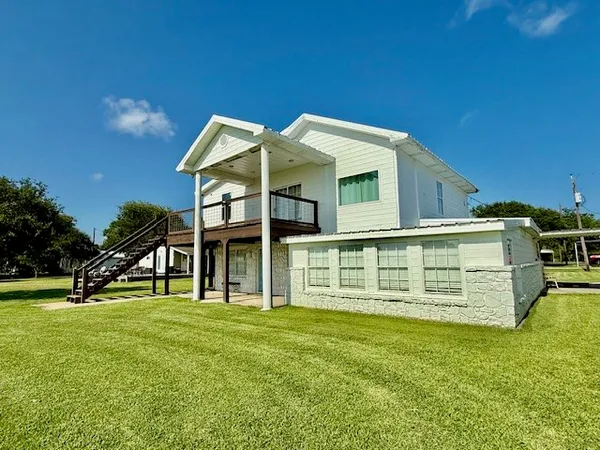 a view of a house with a big yard