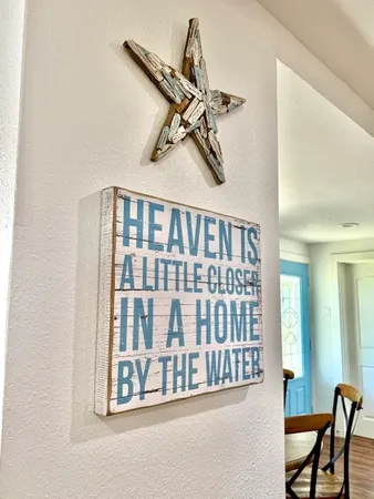 a living room with furniture fireplace and flat screen tv
