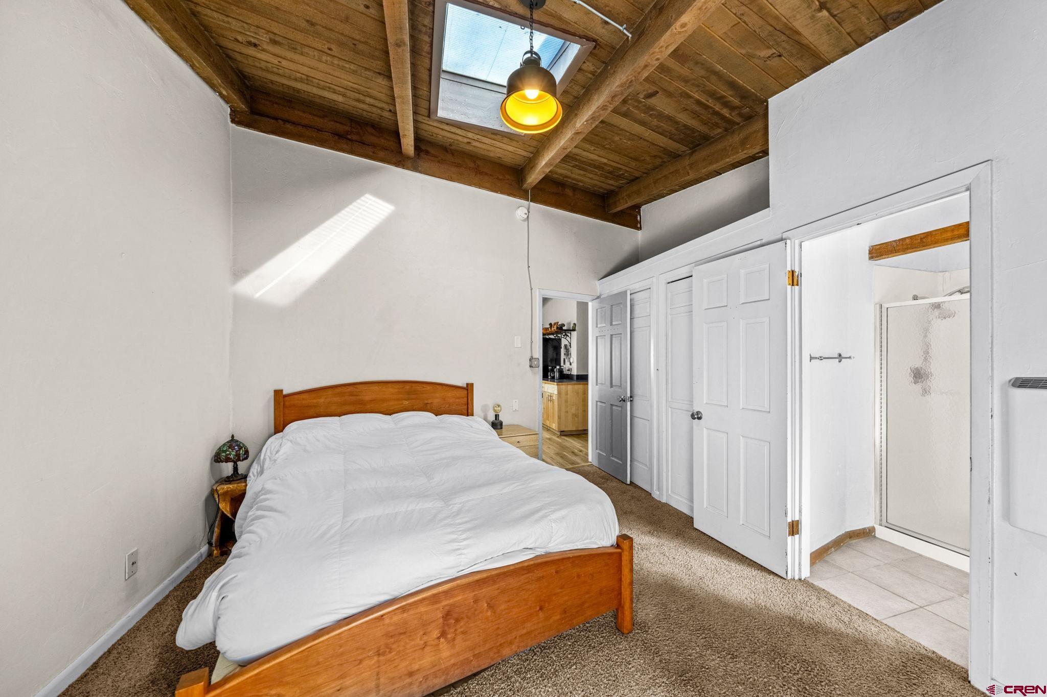 17 Maple Drive Durango, CO 81301 - Photo 19 of 44 a bedroom with a bed and a window