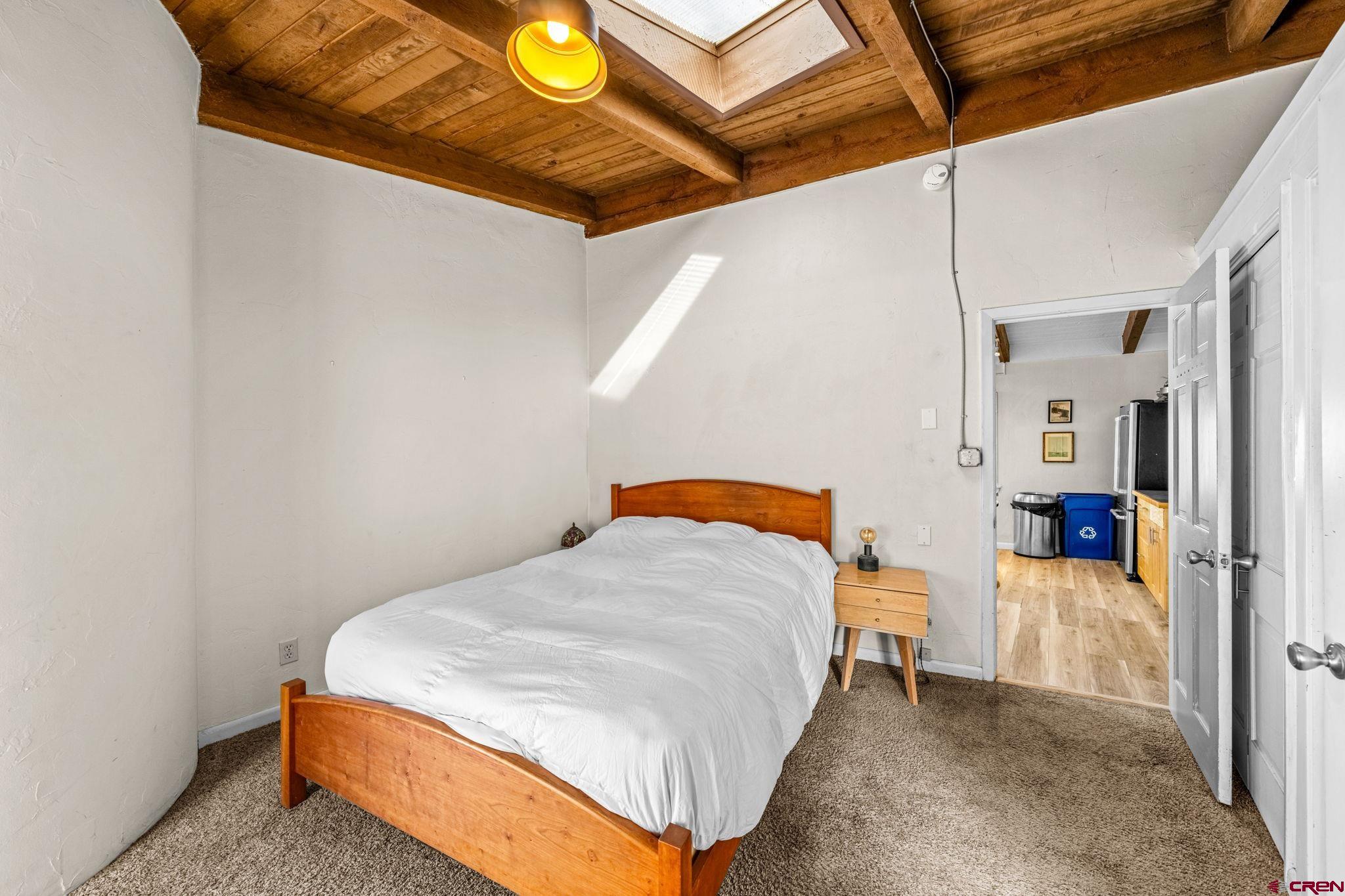 17 Maple Drive Durango, CO 81301 - Photo 20 of 44 a bedroom with a bed and utility room with windows
