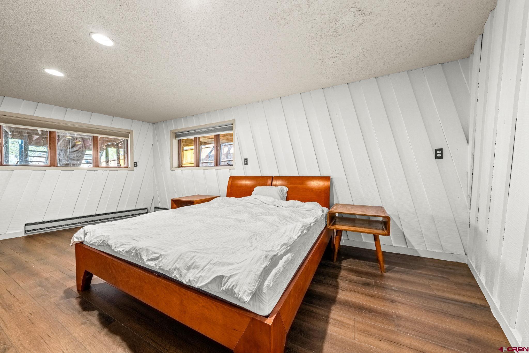 17 Maple Drive Durango, CO 81301 - Photo 23 of 44 a bed sitting in a bedroom next to a window