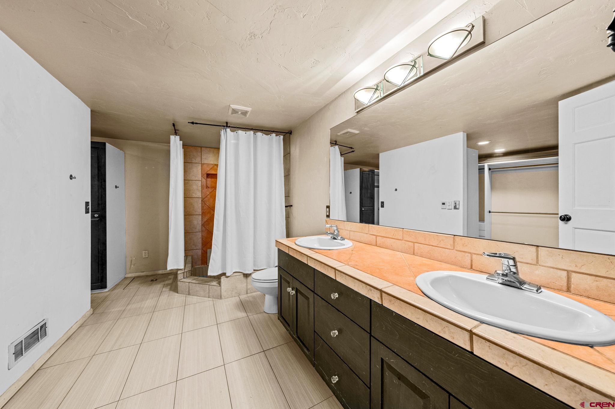 17 Maple Drive Durango, CO 81301 - Photo 26 of 44 a bathroom with a sink double vanity and a mirror