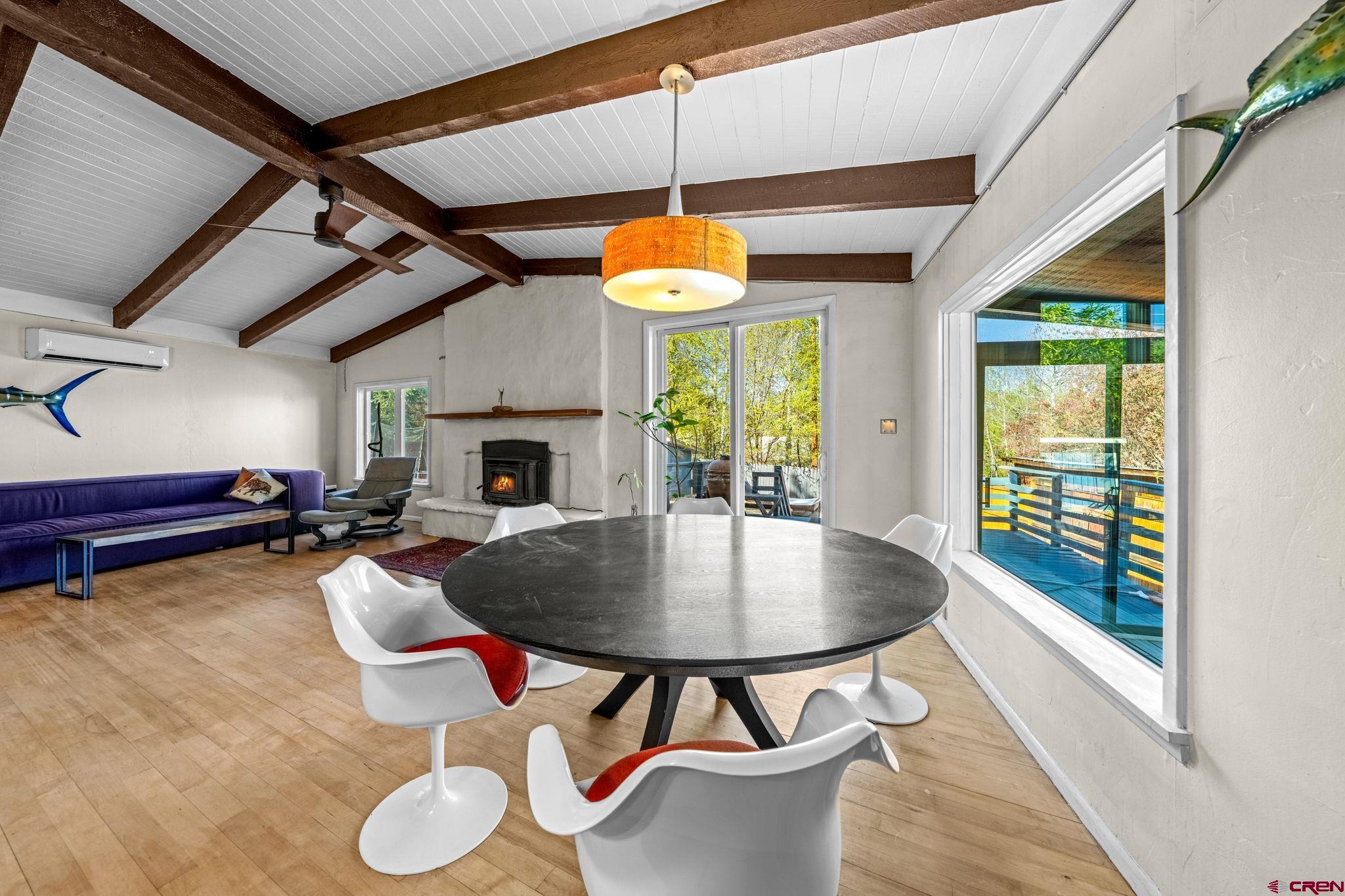 17 Maple Drive Durango, CO 81301 - Photo 3 of 44 a living room with dining table and a fireplace