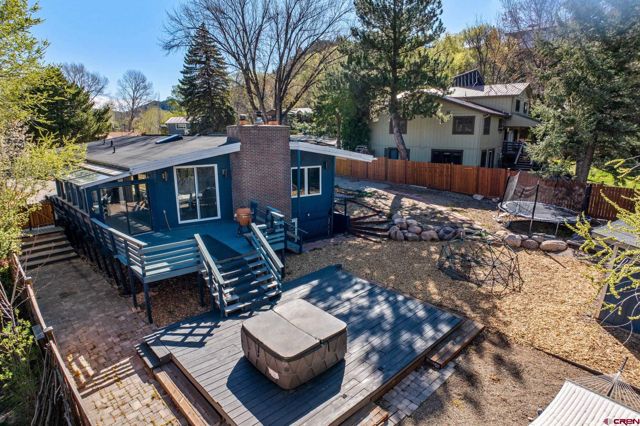 17 Maple Drive Durango, CO 81301 - Photo 31 of 44 a view of a wooden deck with chairs and a fire pit