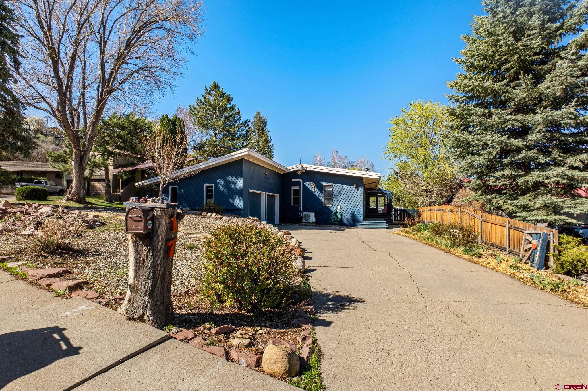 17 Maple Drive Durango, CO 81301 - Photo 37 of 44 a front view of a house with a yard