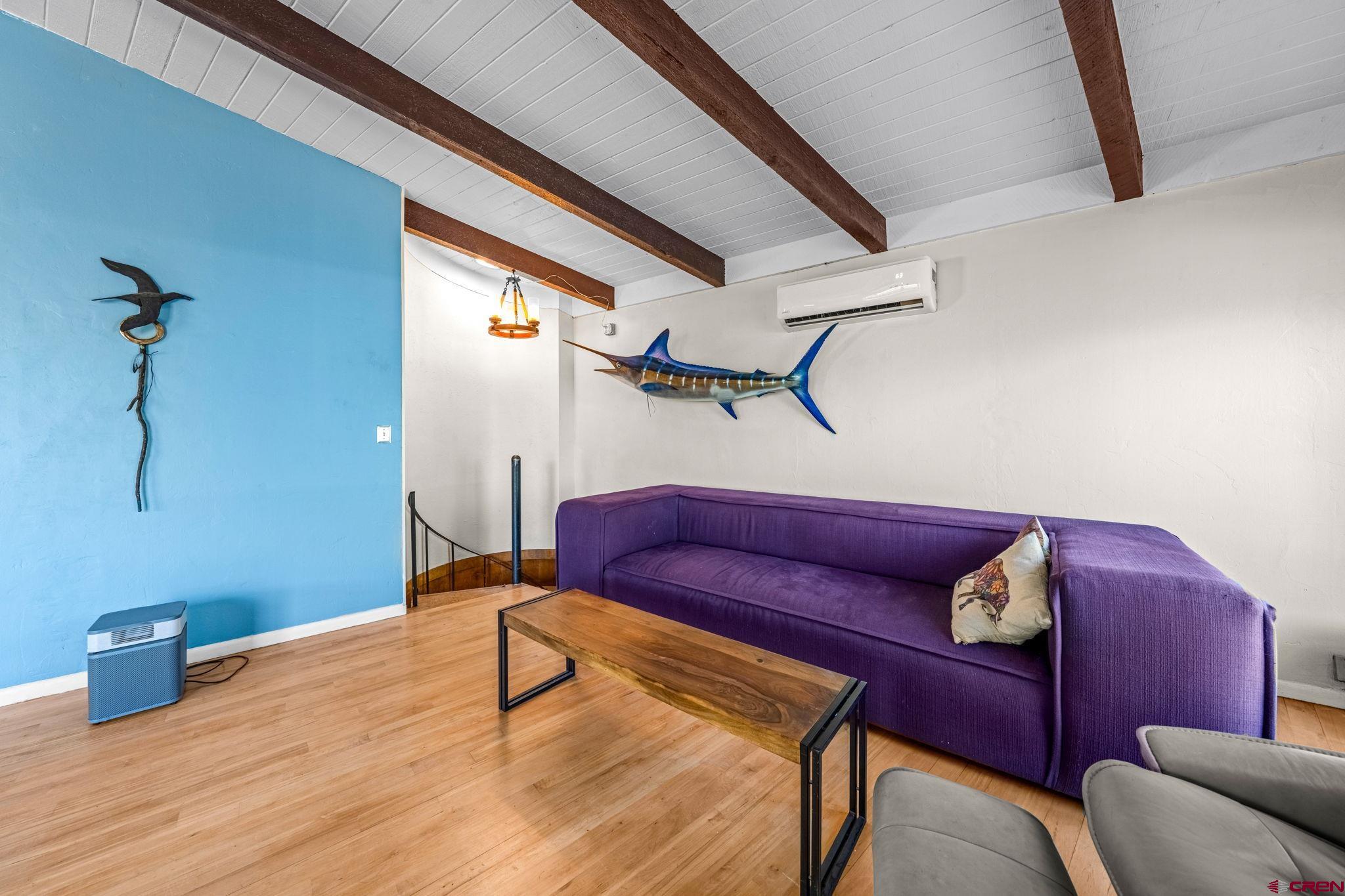 17 Maple Drive Durango, CO 81301 - Photo 8 of 44 a bedroom with a bed and a chandelier