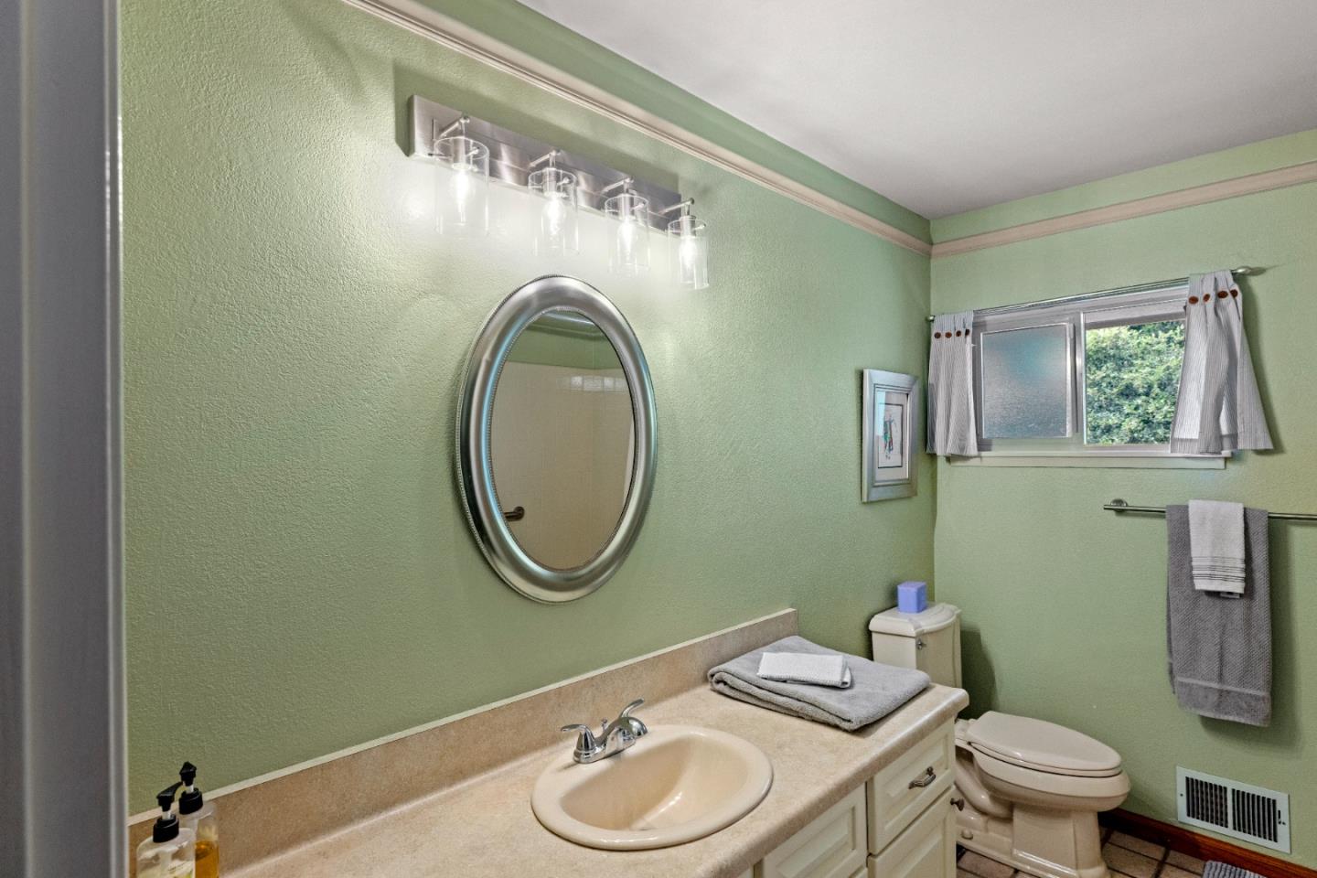 2 Mesa Del Sol Salinas, CA 93908 - Photo 38 of 61 a bathroom with a toilet a sink and a mirror