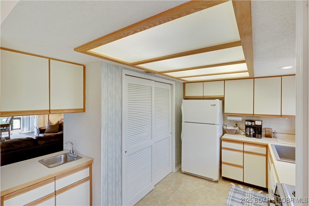 24 East Casa Del Rio, Unit 693 Lake Ozark, MO 65049 - Photo 12 of 30 Kitchen with laundry closet.