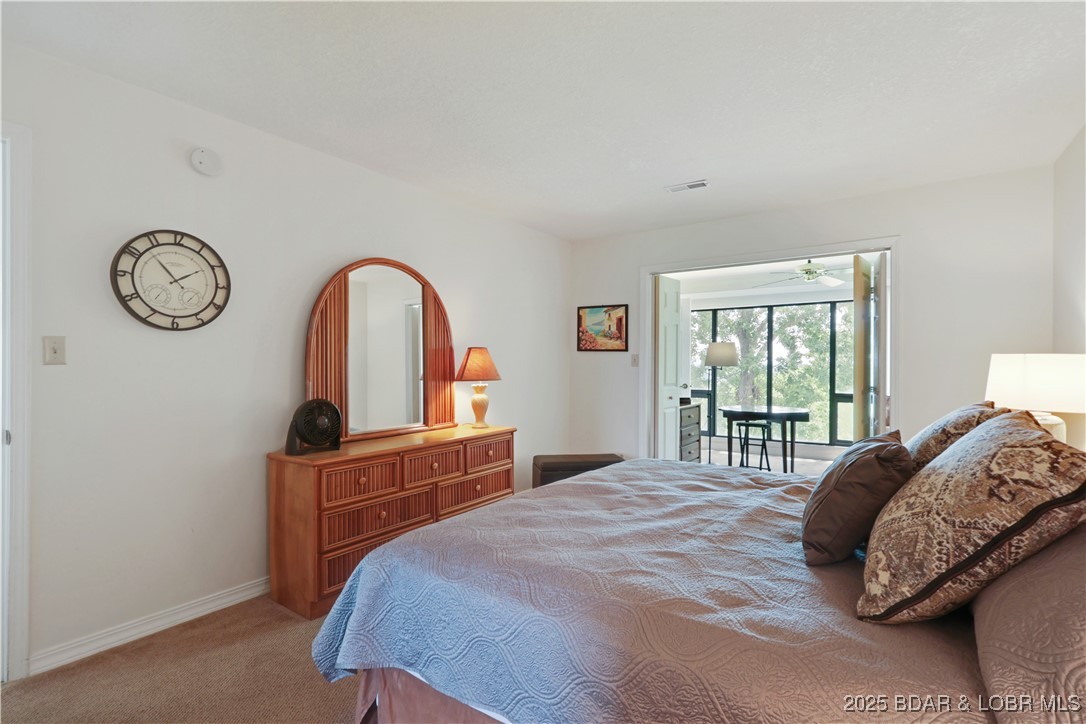 24 East Casa Del Rio, Unit 693 Lake Ozark, MO 65049 - Photo 18 of 30 Master bedroom.